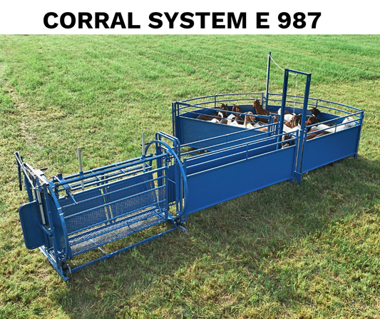 Blue livestock corral system with animals on a grassy field, labeled 'CORRAL SYSTEM E 987'.